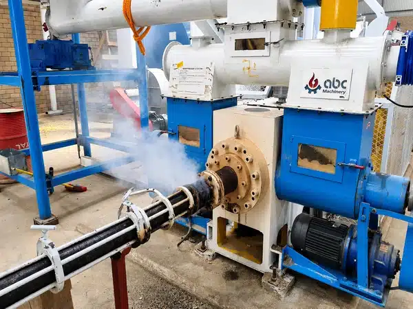 Stamping Briquette Press Die Head And Heating Zone Closeup During Production